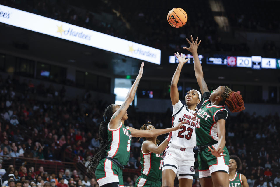 South Carolina guard Bree Hall (23) shoots over Mississippi Valley State forwardS Lizzie Walker, left, forward Amberly Brown during the first half of an NCAA college basketball game in Columbia, S.C., Friday, Nov. 24, 2023. (AP Photo/Nell Redmond)