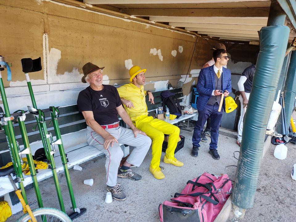 From left, former major league pitcher Bill Lee, Savannah Bananas owner Jesse Cole and magician Jake Schwartz watch from the home team dugout the tryouts for the Savannah Bananas Premier Team on Feb. 26, 2022 at Grayson Stadium.