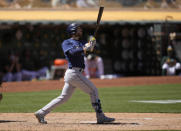 Tampa Bay Rays' Brandon Lowe watches the flight of his two-run home run during the sixth inning of a baseball game against the Oakland Athletics, Saturday, May 8, 2021, in Oakland, Calif. (AP Photo/Tony Avelar)