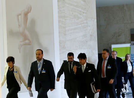 Nasr al-Hariri, chief negotiator of the Syrian High Negotiations Committee (HNC) opposition group (2L) arrives with other members to address the media after a Intra-Syria peace talks meeting in Geneva, Switzerland, March 1, 2017. REUTERS/Denis Balibouse