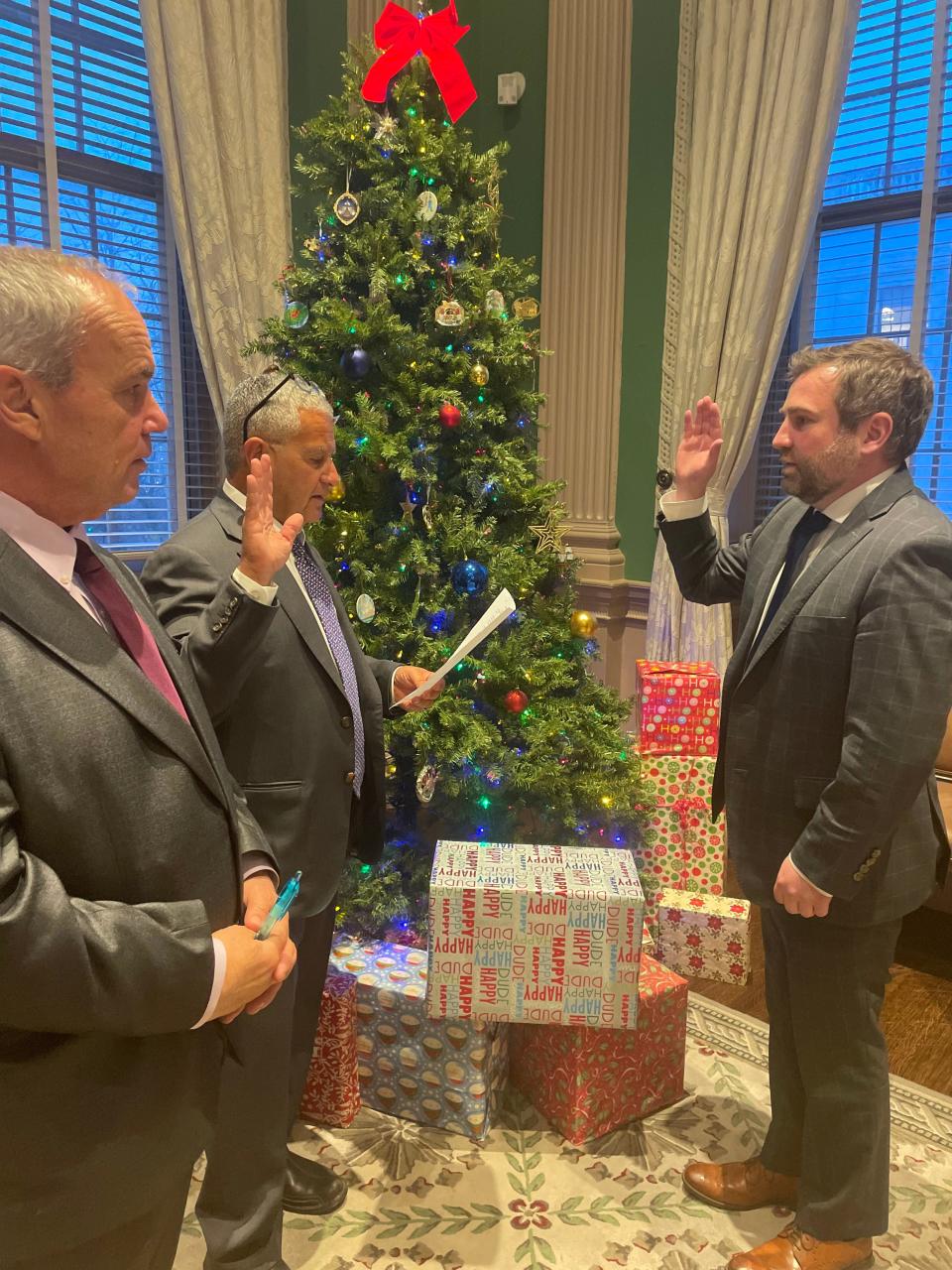 Gov. Councilor Joe Ferreira swears in Nick Bernier with Gov. Councilor Terrence Kennedy in the forefront.