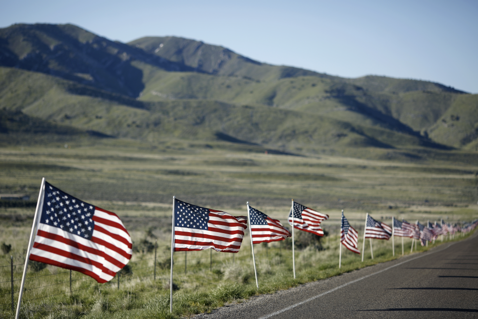 American flags are displayed along an access road during a celebration of the 150th anniversary of the completion of the transcontinental railroad at Golden Spike National Historic Park in Promontory Summit, Utah, U.S., on Friday, May 10, 2019. (Photo: Luke Sharrett/Bloomberg via Getty Images)
