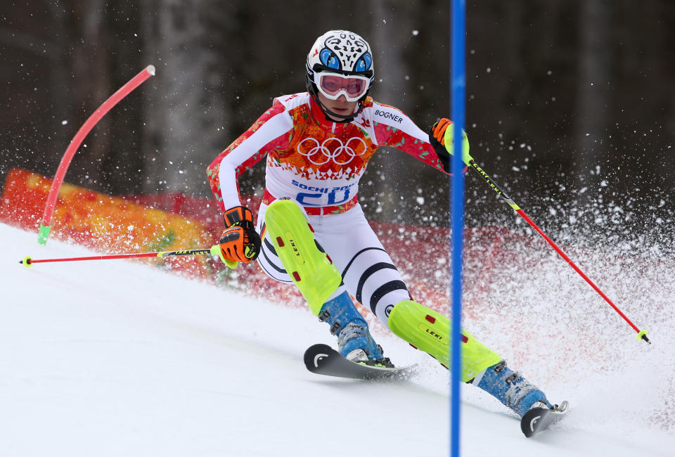 Germany's Maria Hoefl-Riesch passes a gate in the slalom portion of the women's supercombined to win the gold medal in the Sochi 2014 Winter Olympics, Monday, Feb. 10, 2014, in Krasnaya Polyana, Russia.(AP Photo/Alessandro Trovati)