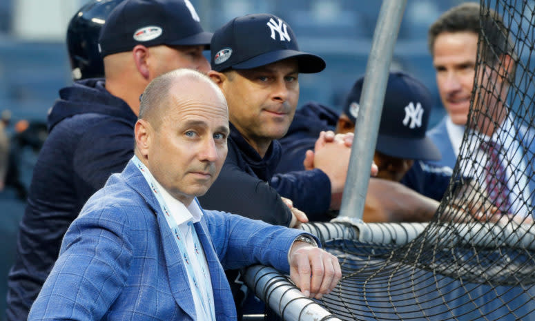 Brian Cashman alongside Aaron Boone.