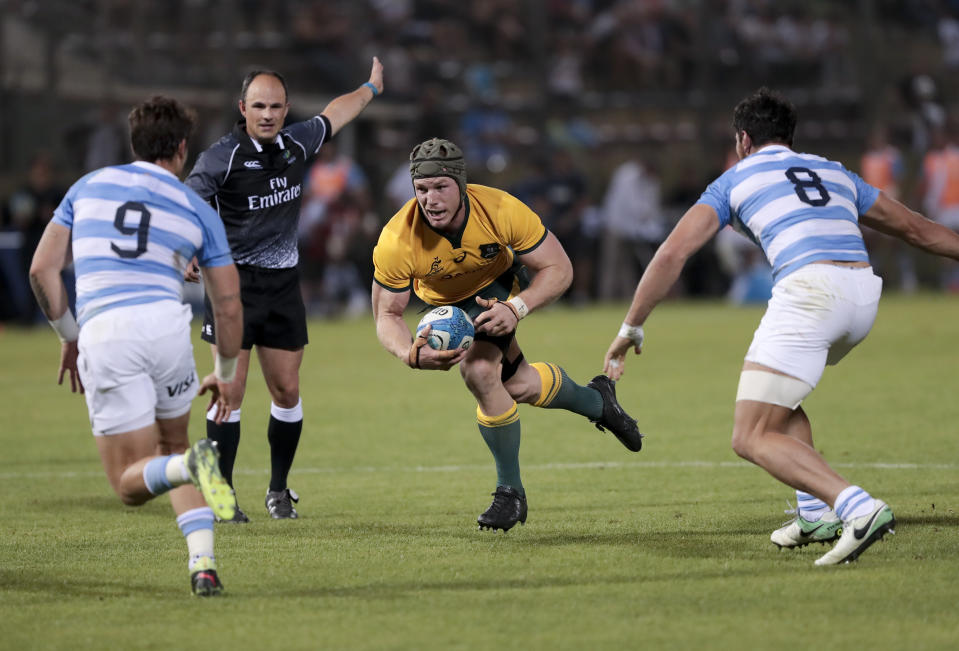 Australia's David Pocock, center, runs with the ball during their Rugby Championship match against Argentina in Salta, Argentina, Saturday, Oct. 6, 2018. (AP Photo/Gonzalo Prados)