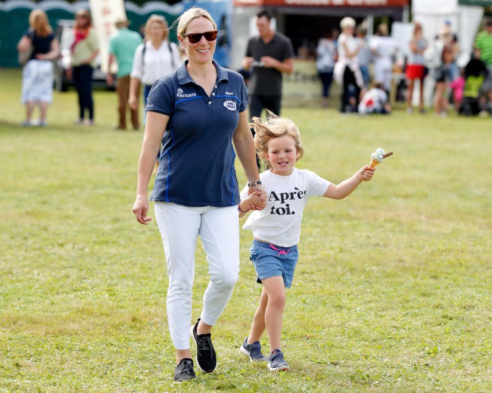 STROUD, UNITED KINGDOM - SEPTEMBER 15: (EMBARGOED FOR PUBLICATION IN UK NEWSPAPERS UNTIL 24 HOURS AFTER CREATE DATE AND TIME) Zara Tindall walks hand in hand with daughter Mia Tindall (eating an ice cream) as they attend day 3 of the Whatley Manor Gatcombe International Horse Trials at Gatcombe Park on September 15, 2019 in Stroud, England. (Photo by Max Mumby/Indigo/Getty Images)