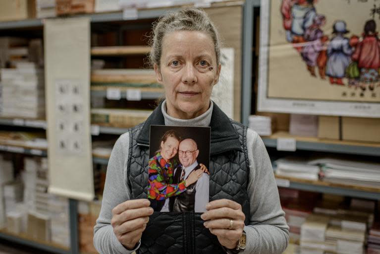 Karen Short, the wife of Australian missionary John Short, who is currently detained in North Korea, holds a picture of herself and her husband in Hong Kong on February 20, 2014