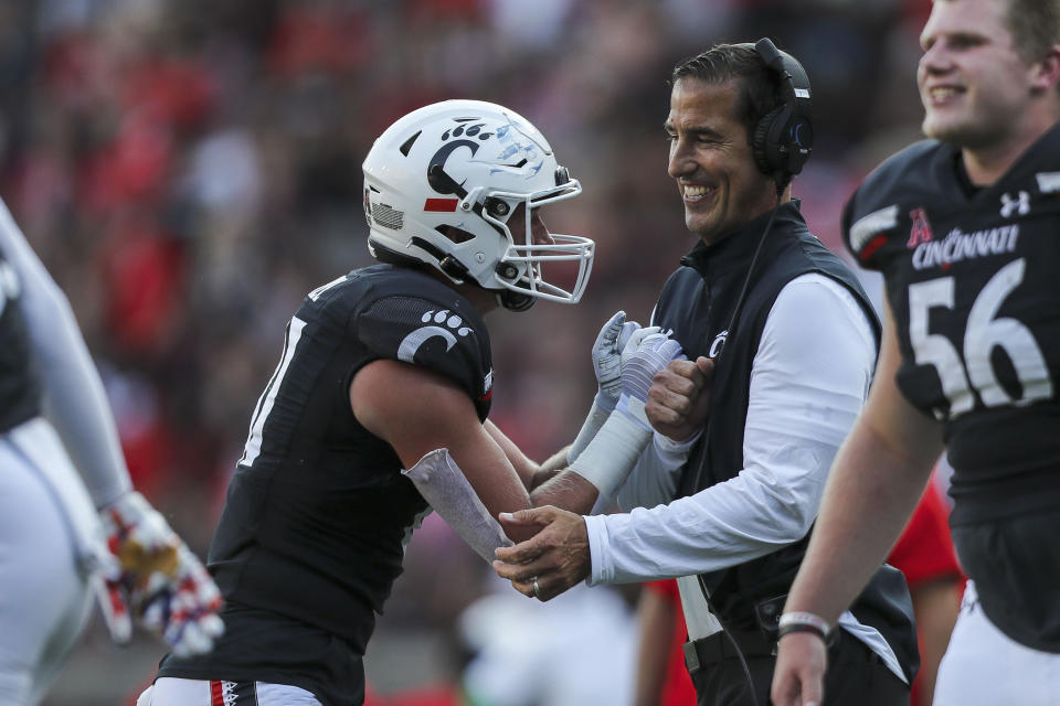 Sep 11, 2021; Cincinnati, Ohio, USA; Cincinnati Bearcats tight end Josh Whyle (81) celebrates after a touchdown with head coach Luke Fickell in the second half against the Murray State Racers at Nippert Stadium. Mandatory Credit: Katie Stratman-USA TODAY Sports