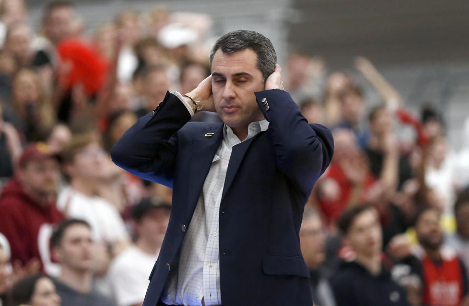 Colgate's head coach Matt Langel holds his head in the second half in the NCAA Patriot League Conference basketball championship against Boston University at Cotterell Court, Wednesday, March 11, 2020, in Hamilton, N.Y. (AP Photo/John Munson)