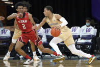 Washington guard Quade Green (55) drives past Utah guard Ian Martinez (2) during the second half of an NCAA college basketball game, Sunday, Jan. 24, 2021, in Seattle. Washington won 83-79. (AP Photo/Ted S. Warren)