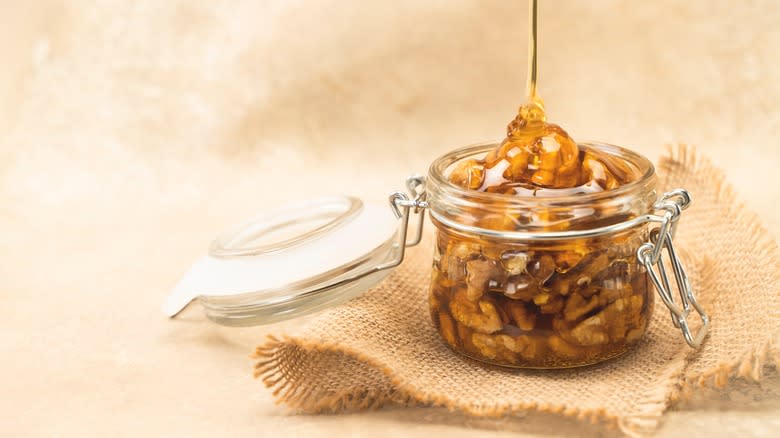 Walnuts in syrup with jar