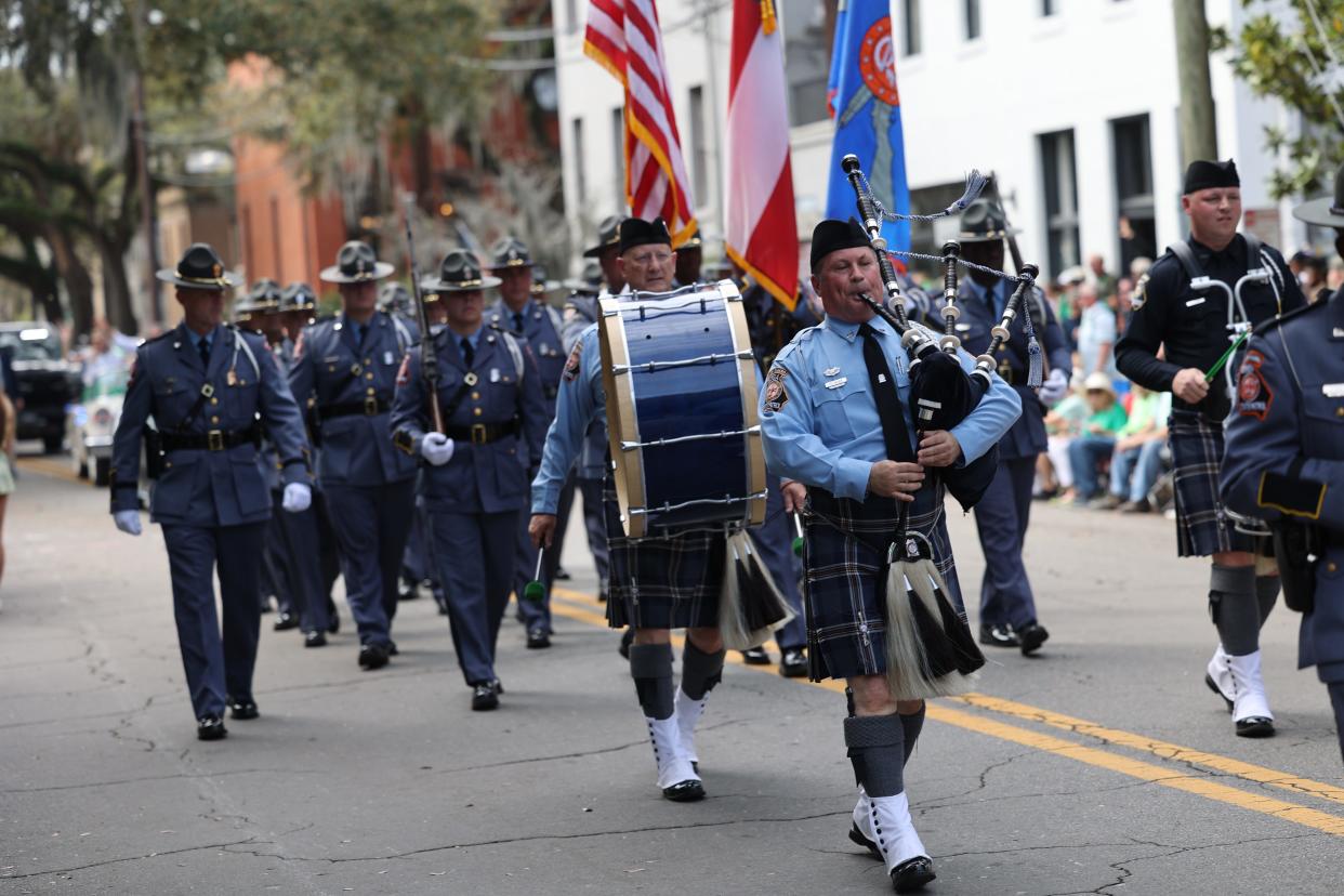 The Georgia State Patrol marches along Abercorn during the Savannah St. Patrick's Day Parade on Saturday, March 16, 2024.