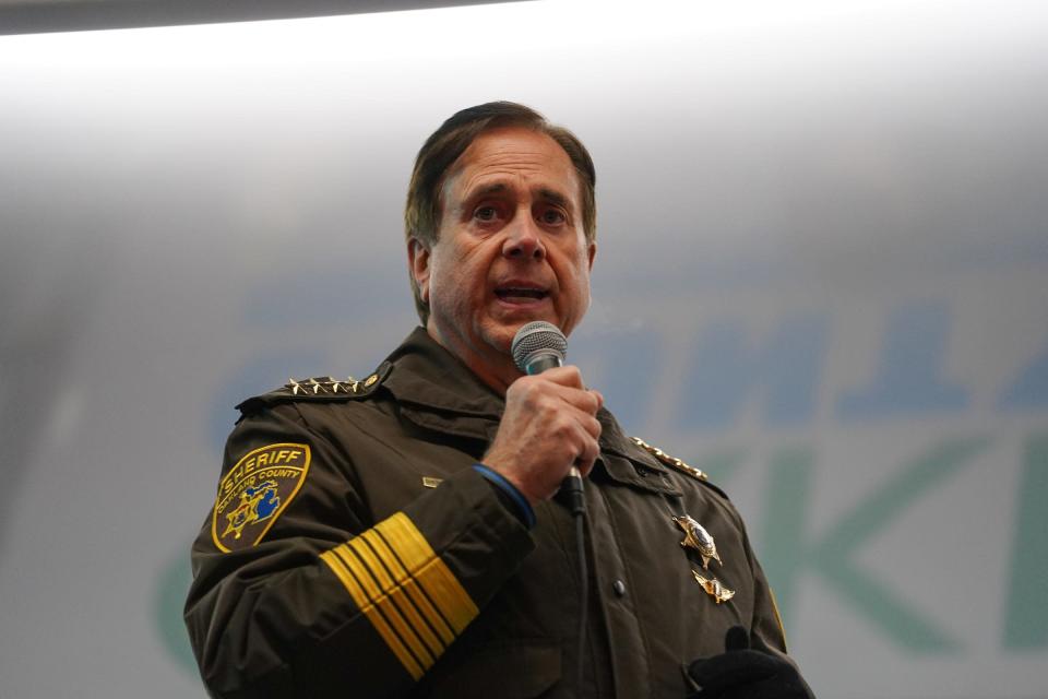 Oakland County Sheriff Michael Bouchard speaks to a crowd during a vigil along M24 in downtown Oxford on Friday, December 3, 2021, for the Oxford community after an active shooter situation at Oxford High School left four students dead and multiple others with injuries.