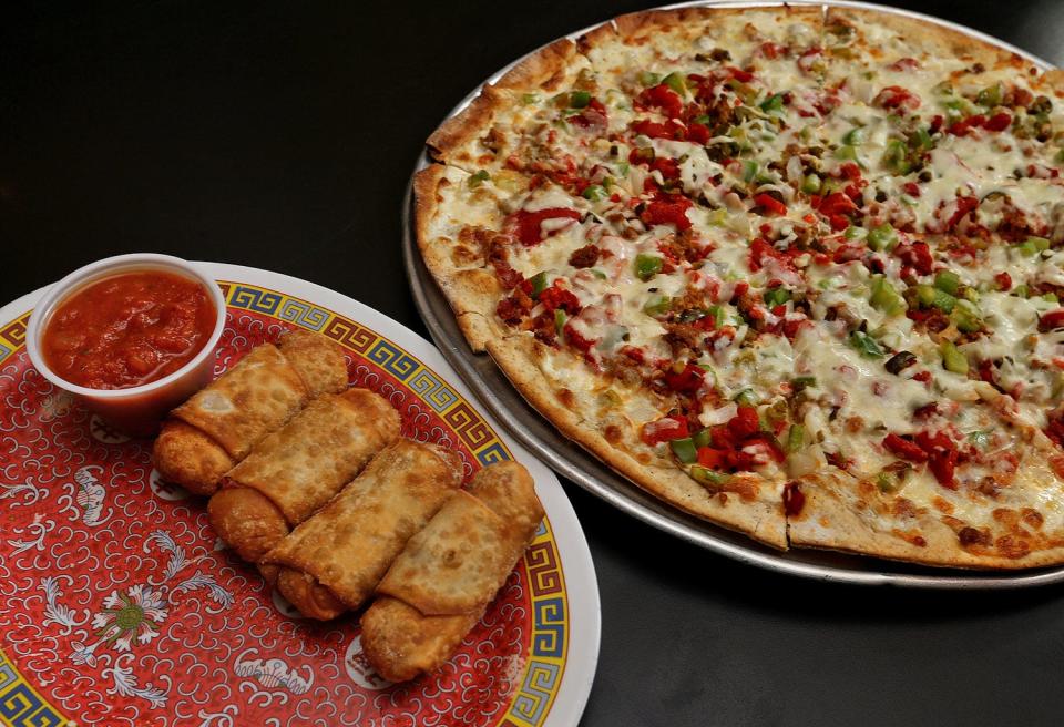 Pizza rolls left, and the Bacon popper pizza with thin, brown crust, right, served at Fong’s, 223 Fourth St. in Des Moines.