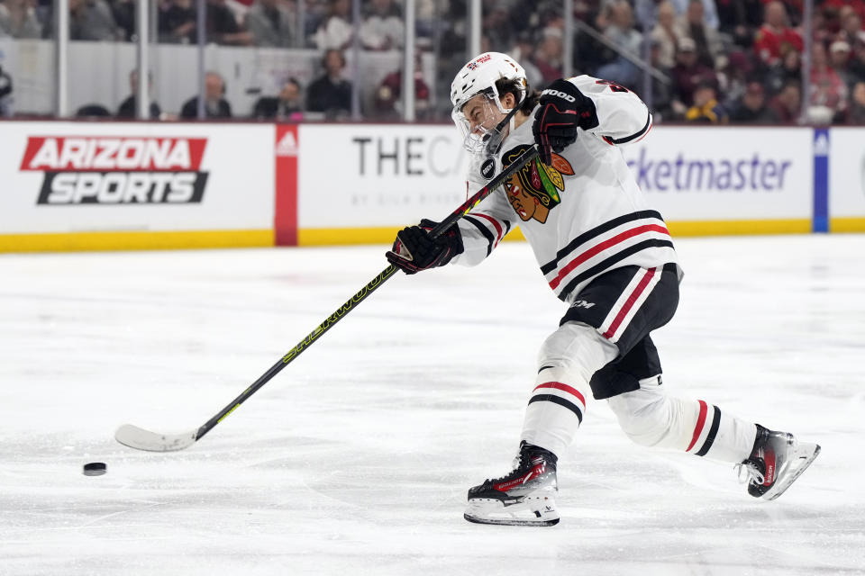 Chicago Blackhawks center Connor Bedard shoots on goal against the Arizona Coyotes in the second period during an NHL hockey game, Tuesday, March 5, 2024, in Tempe, Ariz. (AP Photo/Rick Scuteri)