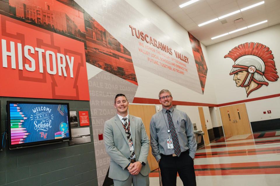 Derek Varansky, superintendent of Tusky Valley School, left, and Jason Phillips, principal at Tusky Valley Middle-High School, are shown in the new facility that features a competition-sized gymnasium, a 504-seat auditorium with an orchestra pit and makeup and changing rooms, flexibility for space and seating, huge windows to provide natural light and the latest technology.