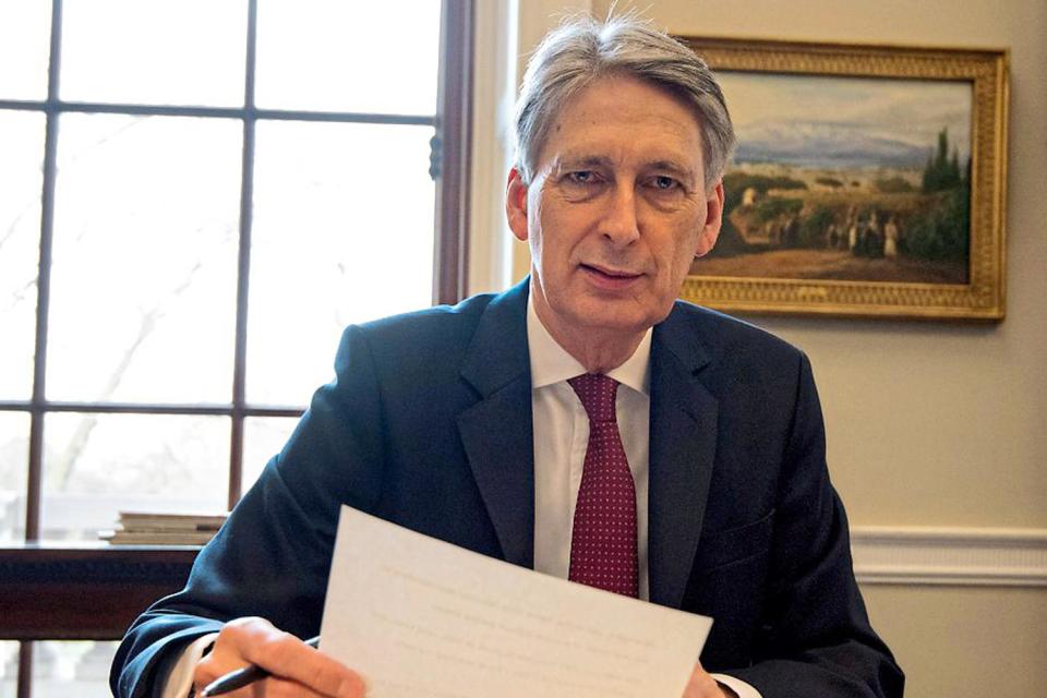 Man with a plan: the Chancellor, Philip Hammond, preparing his Budget speech in his Treasury office yesterday: Getty Images