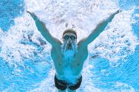 <p>An underwater view shows Hungary's Kristof Milak competes to set a new Olympic Record in a semi-final of the men's 100m butterfly swimming event during the Tokyo 2020 Olympic Games at the Tokyo Aquatics Centre in Tokyo on July 30, 2021. (Photo by François-Xavier MARIT / AFP)</p> 