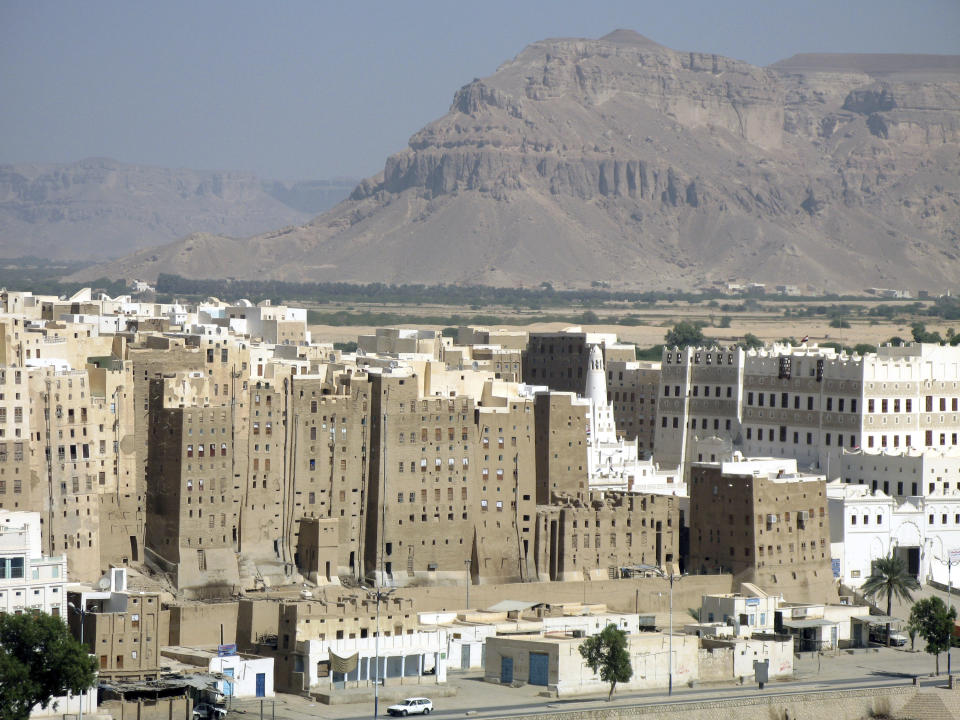 FILE - This Dec. 7, 2007 file photo, shows the historical city of Shibam in Hadramut province, Yemen. A prominent Yemeni rights group has documented heavy damage to at least 34 archaeological sites from the fighting and airstrikes over the past four years. In a report released Thursday, Nov. 15, 2018, the Mawatana Organization for Human Rights said that it collected testimonies from over 75 people working at the archaeological sites and monuments that came under attack since mid-2014. (AP Photo/Mohammed al-Qadhi, File)