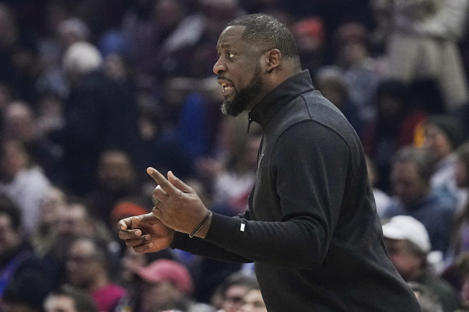 Milwaukee Bucks coach Adrian Griffin gestures during the first half of the team's NBA basketball game against the Cleveland Cavaliers, Wednesday, Jan. 17, 2024, in Cleveland. (AP Photo/Sue Ogrocki)