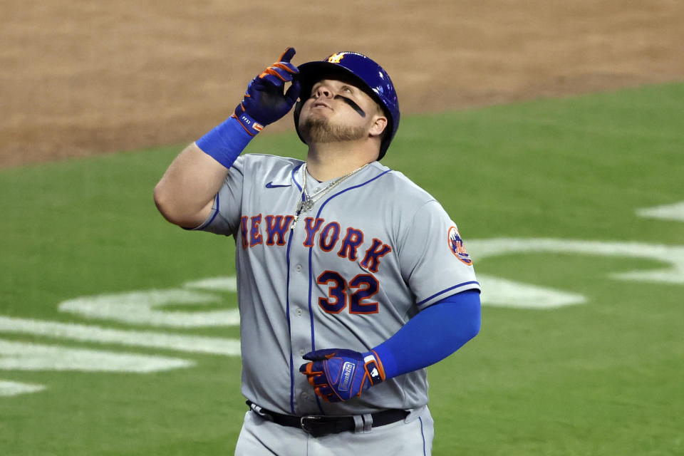 New York Mets' Daniel Vogelbach reacts after hitting a two run homer during the sixth inning of a baseball game against the Atlanta Braves, Tuesday, Aug. 22, 2023, in Atlanta. (AP Photo/Butch Dill)