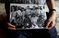 Lee Hak-rae, last surviving Korean war criminal during World War II holds copy of photo in Tokyo