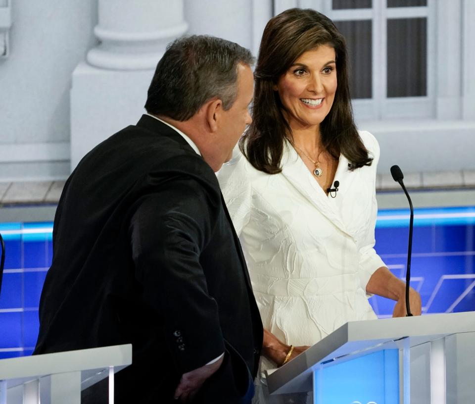 Former New Jersey Gov. Chris Christie and former South Carolina Gov. Nikki Haley during a break in the Republican National Committee presidential primary debate hosted by NBC News at Adrienne Arsht Center for the Performing Arts of Miami-Dade County.