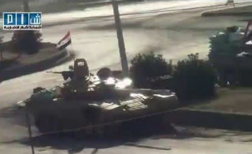 An image grab from a video uploaded on YouTube shows Syrian army tanks in the city of Hama. Note: AFP is not authorized to cover this event and is therefore using pictures from alternative sources, which cannot be independently verified