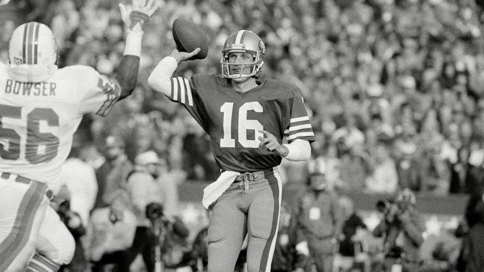 Mandatory Credit: Photo by Anonymous/AP/Shutterstock (6577908f)Joe Montana San Francisco 49ers quarterback Joe Montana (16) unloads to downfield receiver over rushing hands of Miami Dolphins linebacker Charles Bowser (56) during first quarter of Super Bowl XIX at Stanford Stadium, Calif.