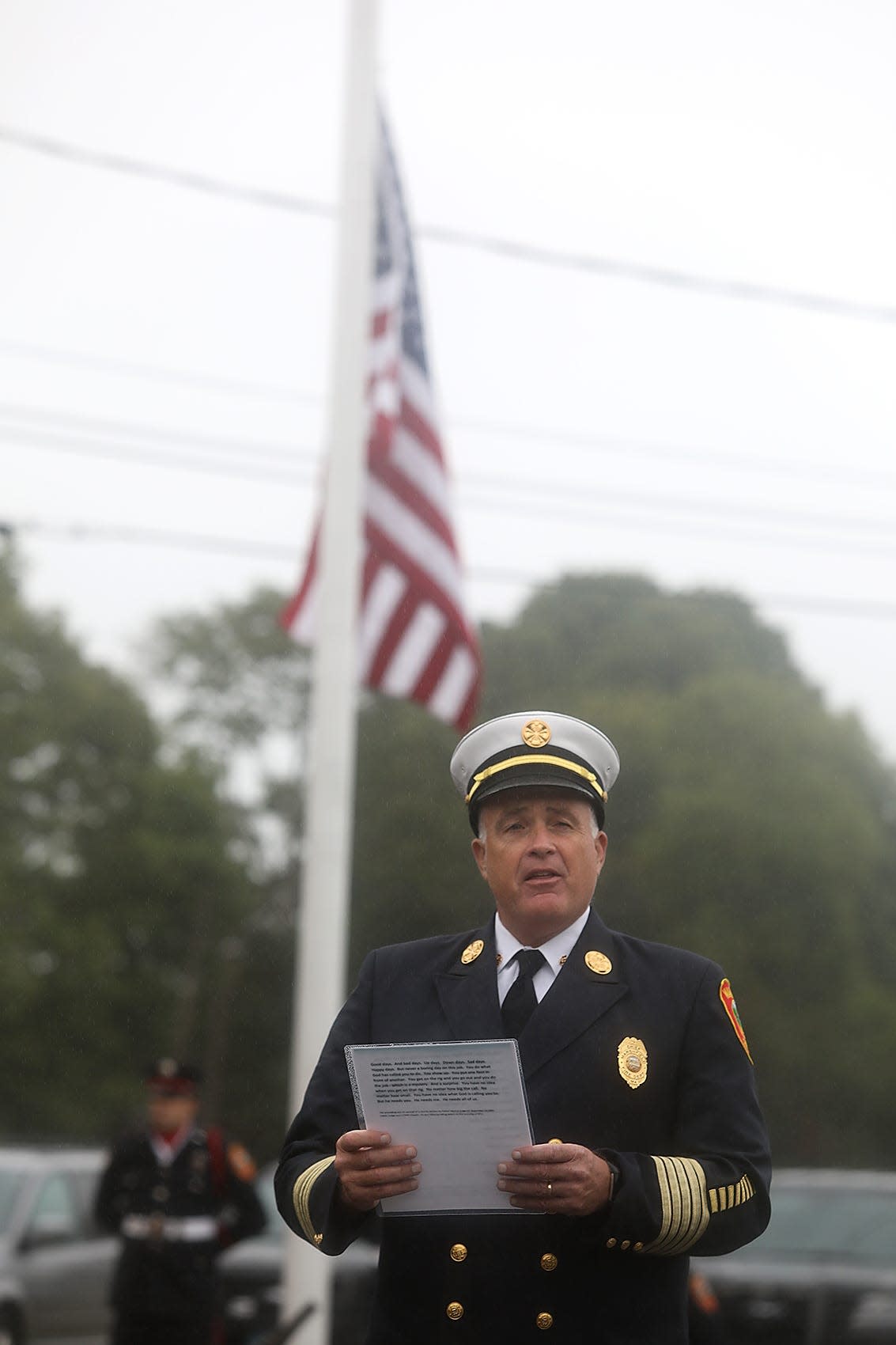 Marshfield Fire Chief William Hocking reads a poem written by the Rev. Mychal Judge, FDNY chaplain, who wrote the prayer on Sept. 10, the day before the attacks that would claim his life, during the remembrance ceremony at the fire station on Friday, Sept. 11, 2020.