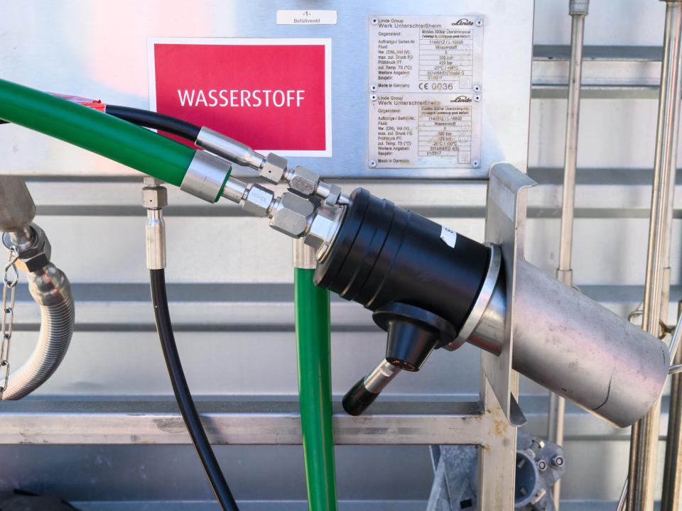 A hydrogen sign hangs for refueling a hydrogen train Coradia iLint from train manufacturer Alstom on the factory premises.