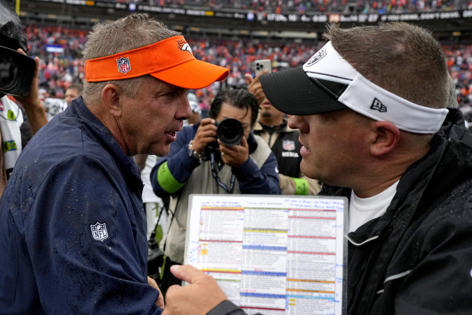 Denver Broncos head coach Sean Payton, left, greets Las Vegas Raiders head coach Josh McDaniels after an NFL football game, Sunday, Sept. 10, 2023, in Denver. The Raiders defeated the Broncos 17-16. (AP Photo/Jack Dempsey)