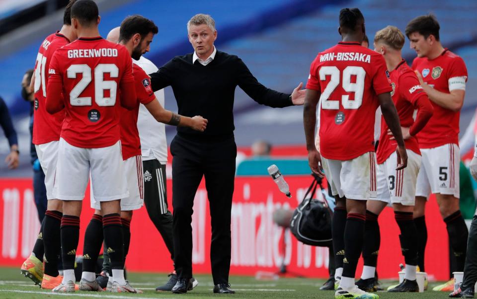 Ole Gunnar Solskjaer talks to his players