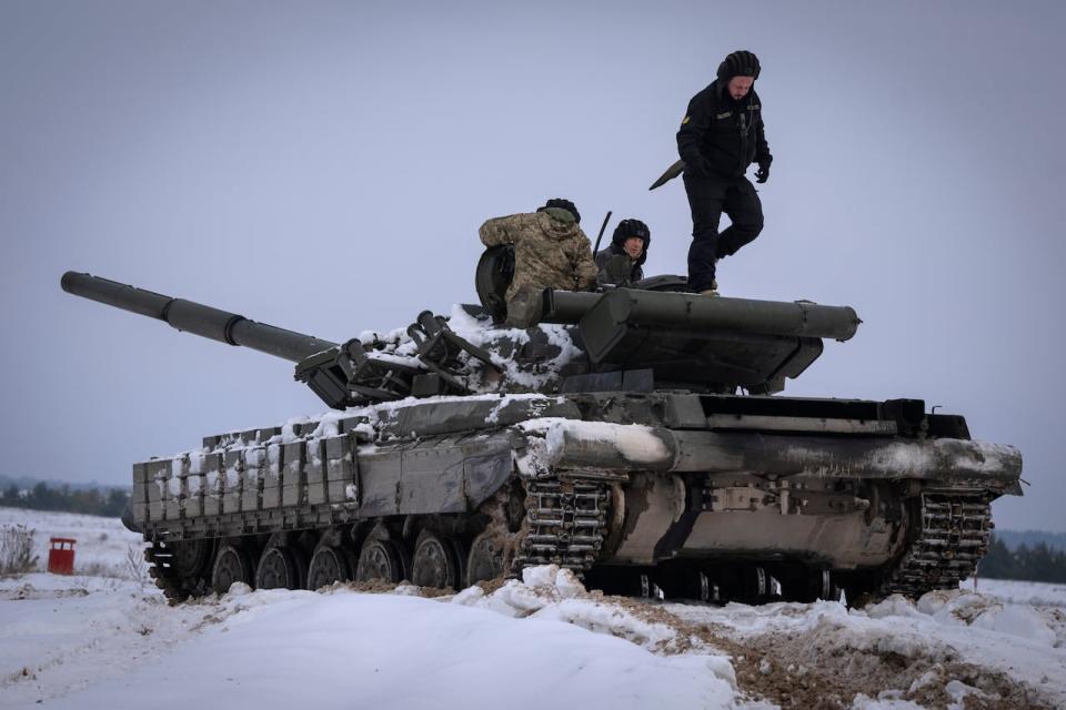 Ukrainian soldiers practice on a tank during military training in Ukraine on Wednesday, Dec. 6, 2023. (Efrem Lukatsky/Associated Press - image credit)