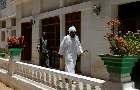 Leading Sudanese opposition figure Sadiq al-Mahdi, Sudan's last democratically elected prime ministe, who was overthrown in 1989 in a bloodless coup by army officer Omar Hassan al-Bashir, walks in his garden before an interview with Reuters in Khartoum, Sudan, April 25, 2019. REUTERS/Umit Bektas