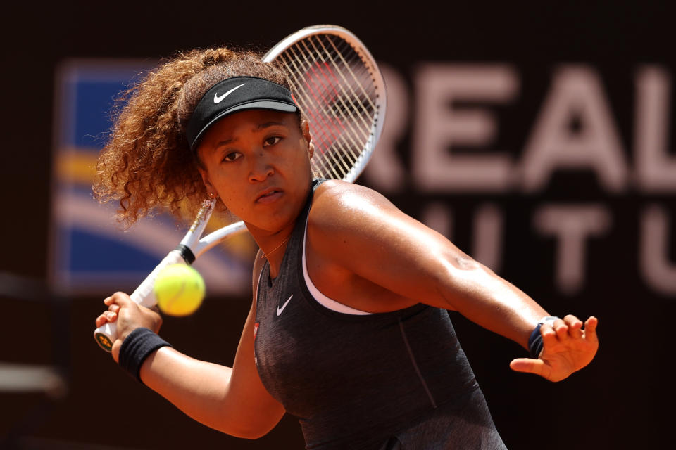 ROME, ITALY - MAY 12:  Naomi Osaka of Japan returns a forehand on day 5 of the the Internazionali BNL d&#x002019;Italia match between Naomi Osaka of Japan and Jessica Pegula of USA at Foro Italico on May 12, 2021 in Rome, Italy. Sporting stadiums around Italy remain under strict restrictions due to the Coronavirus Pandemic as Government social distancing laws prohibit fans inside venues resulting in games being played behind closed doors. (Photo by Clive Brunskill/Getty Images)