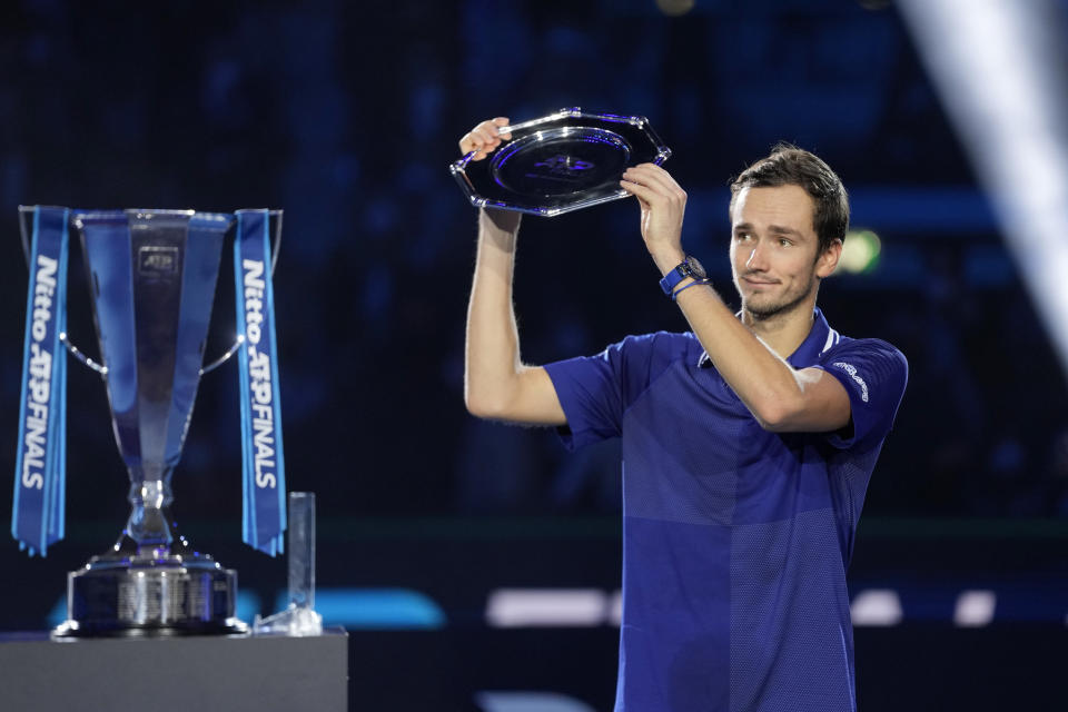 Daniil Medvedev of Russia holds his second place trophy after losing to Alexander Zverev of Germany in their singles final tennis match of the ATP World Tour Finals, at the Pala Alpitour in Turin, Italy, Sunday, Nov. 21, 2021. Zverev won 6-4/6-4.(AP Photo/Luca Bruno)