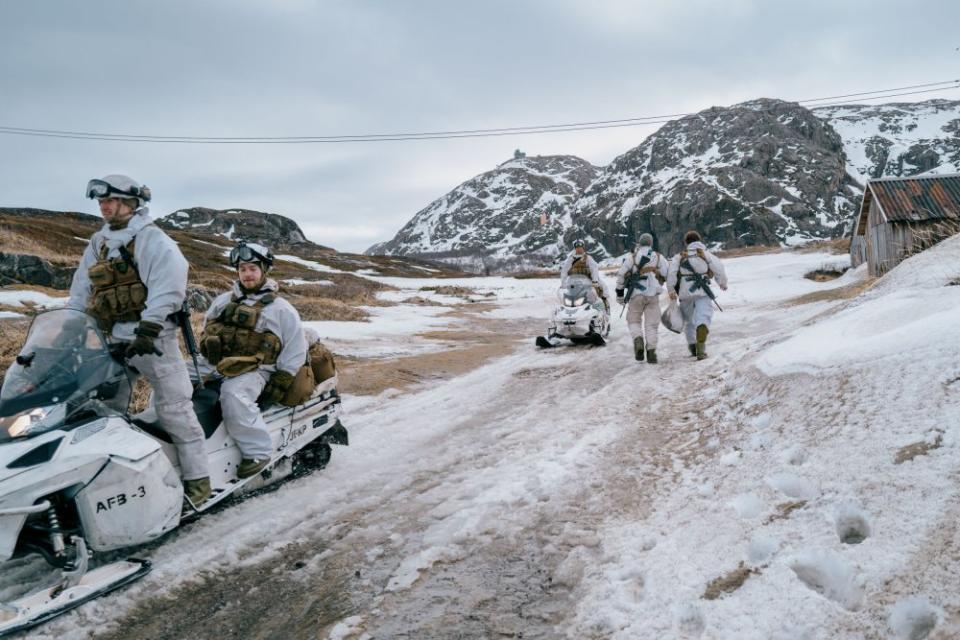 Norwegian soldiers use snowmobiles in Grense Jakobselv near the border with Russia, north of the Arctic Circle.