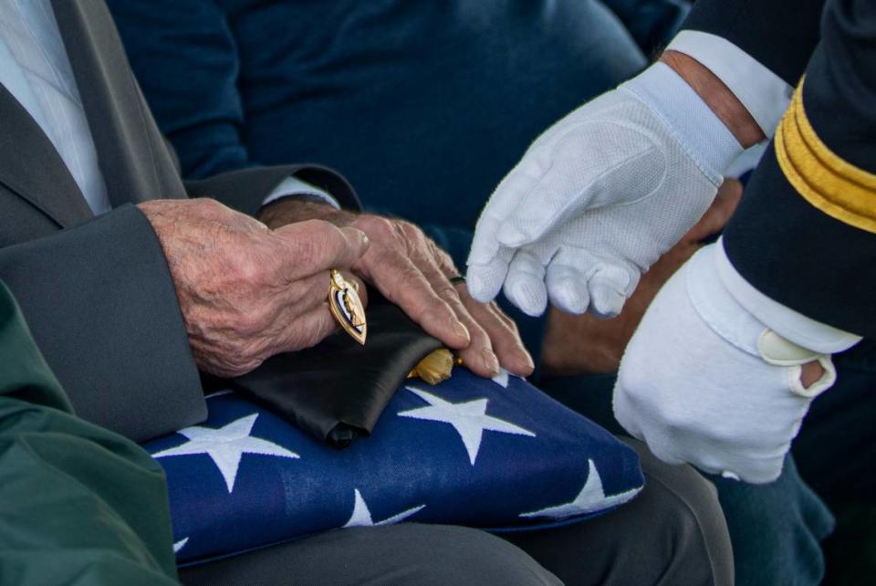 Maj. Gen. Michael Garshak, Idaho’s adjutant general and commander of the state’s National Guard, presented Wilber Bridger, Pfc. Kenneth Bridger’s brother and oldest surviving relative, the U.S. flag and the Purple Heart on his brother’s behalf during the military honors ceremony on May 21, 2022 in Twin Falls, Idaho.