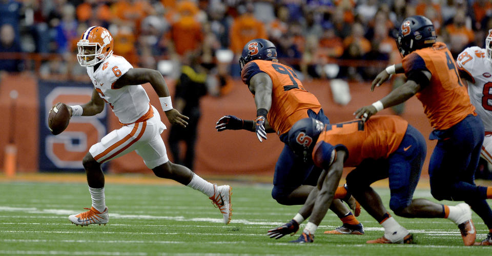 Clemson quarterback Zerrick Cooper (6) scrambles out of the pocket during the second half of an NCAA college football game against Syracuse, Friday, Oct. 13, 2017, in Syracuse, N.Y. Syracuse upset Clemson 27-24. (AP Photo/Adrian Kraus)