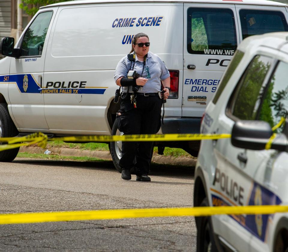 Wichita Falls police investigate the scene of a Zachary Ryan Wood's May 20, 2022, murder at a home on Brown Street as shown in this May 21, 2022, file photo.