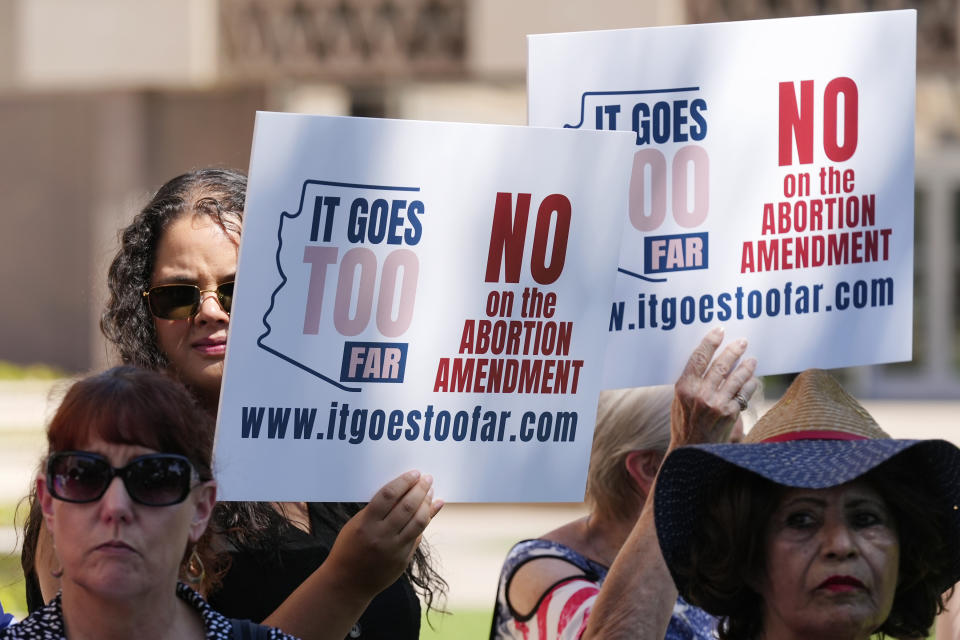 FILE - Anti-abortion protesters gather for a news conference after Arizona abortion-rights supporters deliver over 800,000 petition signatures to the capitol to get abortion rights on the November general election ballot July 3, 2024, in Phoenix. A new poll finds that a solid majority of Americans oppose a federal abortion ban and that a rising number support access to abortions for any reason. (AP Photo/Ross D. Franklin, File)