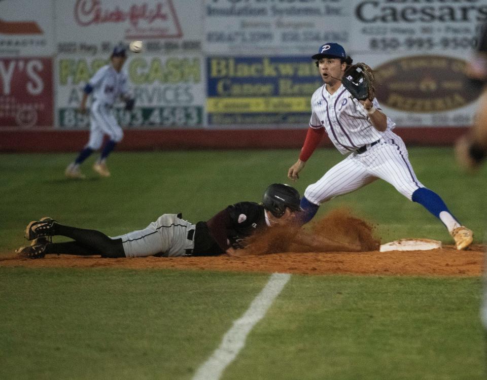 Pace High's Alex McCranie covers second base as the Tate runner dives back to the bag during Friday night's home game against the Aggies. 