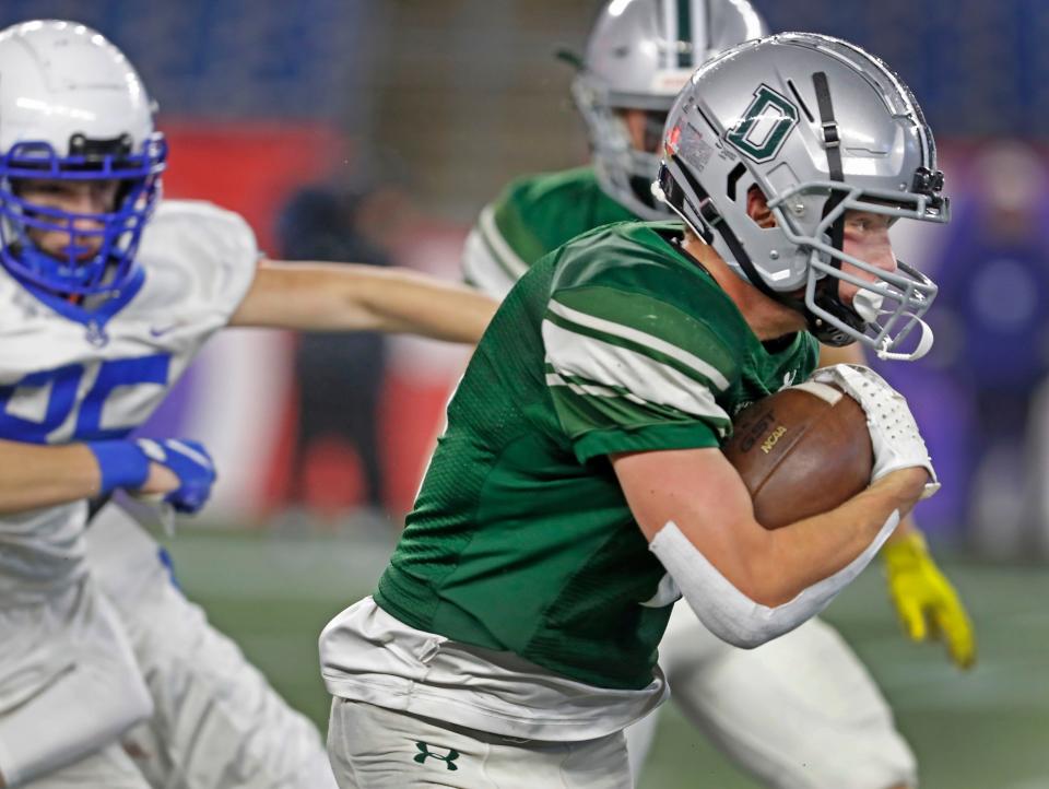 Duxbury's Sam Wien takes a Scituate kickoff 92 yards to the end zone. Duxbury High and Scituate High play the MIAA Division 4 State Championship at Gillette Stadium on Friday, Dec. 1, 2023.