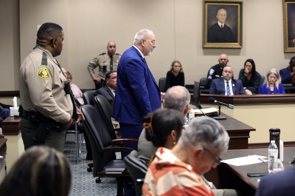 Solicitor Ed Clements, standing, talks about the facts of the case during a sentencing hearing for Frederick Hopkins in Florence, S.C., on Thursday, Oct. 19, 2023. Hopkins was sentenced to life in prison without parole for killing two police officers and wounding five others in an October 2018 ambush at his Florence home (AP Photo/Jeffrey Collins).