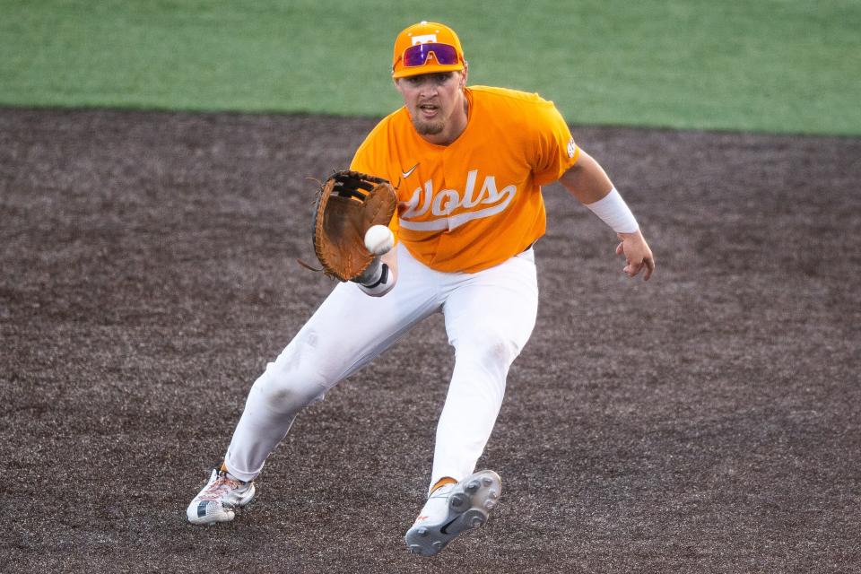 Tennessee first baseman Blake Burke (25) fields a ball against Charleston Southern in an NCAA college baseball game at Lindsey Nelson Stadium in Knoxville, Tenn. on Tuesday, February 28, 2023.<br>Kns Vols Baseball Charleston Southern Bp