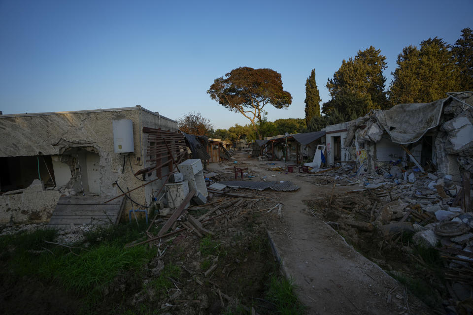 Israeli soldier inspect houses damaged by Hamas militants in Kibbutz Kfar Azza, Israel, Sunday, Nov. 5, 2023. The Kibbutz was overrun by Hamas militants from the nearby Gaza Strip on Oct. 7, when they killed and captured many Israelis (AP Photo/Ariel Schalit)