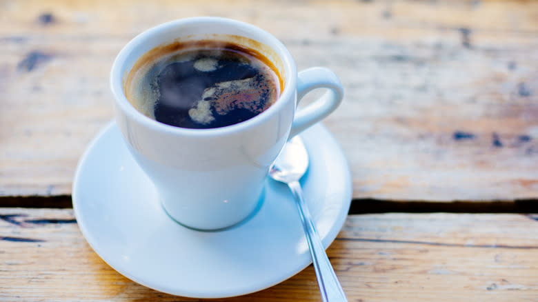 Cup of coffee in white mug 