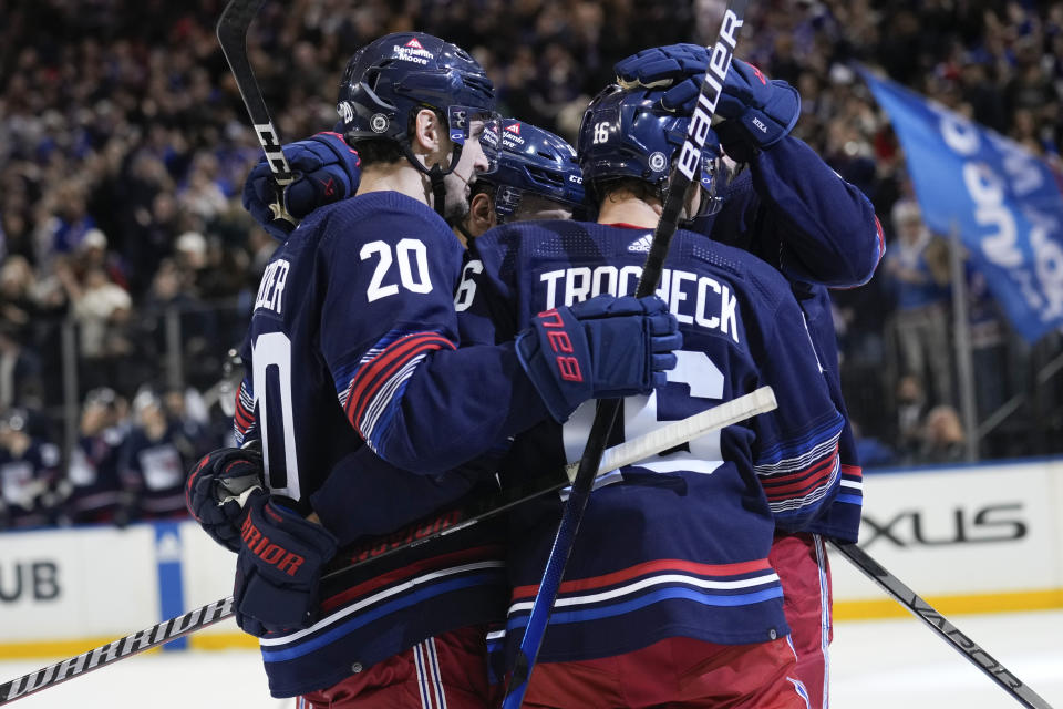 New York Rangers' Chris Kreider (20) celebrates his goal against the Anaheim Ducks with teammates during the second period of an NHL hockey game Friday, Dec. 15, 2023, in New York. (AP Photo/Seth Wenig)