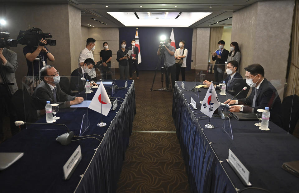 South Korea's Special Representative for Korean Peninsula Peace and Security Affairs Noh Kyu-duk, right, meets with Director-General of the Asian and Oceanian Affairs Bureau of the Ministry of Foreign Affairs of Japan Takehiro Funakoshi during their bilateral meeting at a hotel in Seoul, Monday, June 21, 2021. (Jung Yeon-Je/Pool Photo via AP)